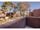 Community view showcasing manicured grounds, pathways, and residential buildings at 4050 Pacific Harbors Dr # 246, Las Vegas, NV 89121