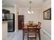 Cozy dining area with wood table and chairs, near the kitchen at 4050 Pacific Harbors Dr # 246, Las Vegas, NV 89121