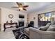 Bright living room with fireplace, comfy seating, and patio access at 4050 Pacific Harbors Dr # 246, Las Vegas, NV 89121