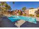 Sparkling community pool with surrounding patio at 4050 Pacific Harbors Dr # 246, Las Vegas, NV 89121