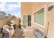 Small backyard with patio, grill, and seating at 4129 Chamisa Cove St, Las Vegas, NV 89115