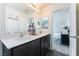 Modern bathroom with dual vanity sinks and a large mirror at 4129 Chamisa Cove St, Las Vegas, NV 89115