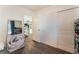 Bedroom with mirrored closet doors and large artwork at 4129 Chamisa Cove St, Las Vegas, NV 89115