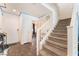 Entryway with staircase, wood-look floors, and access to other rooms at 4129 Chamisa Cove St, Las Vegas, NV 89115