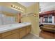 Double vanity bathroom with a view of the bedroom at 429 Nancy Dr, Henderson, NV 89015