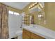 Clean bathroom with shower/tub combo, vanity, and updated fixtures at 429 Nancy Dr, Henderson, NV 89015