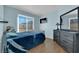 Light blue bedroom with a dresser and a full-size bed at 429 Nancy Dr, Henderson, NV 89015