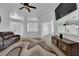 Living room featuring a ceiling fan, and leather couches at 429 Nancy Dr, Henderson, NV 89015