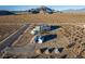 Aerial view of house, RV, and surrounding desert landscape at 4351 W Bell Vista Ave, Pahrump, NV 89060