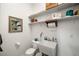 Small bathroom with toilet and utility sink at 4351 W Bell Vista Ave, Pahrump, NV 89060