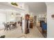 Bright dining area with wood table and chairs, adjacent to kitchen at 4351 W Bell Vista Ave, Pahrump, NV 89060