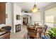 Bright dining room with wood table and chairs, and natural light at 4351 W Bell Vista Ave, Pahrump, NV 89060