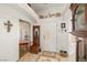 Entryway with tiled floor, coat rack, and decorative wall art at 4351 W Bell Vista Ave, Pahrump, NV 89060