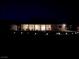 Night view of a home with a covered patio and desert landscaping at 4351 W Bell Vista Ave, Pahrump, NV 89060