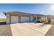 Three car garage with attached covered patio at 4351 W Bell Vista Ave, Pahrump, NV 89060