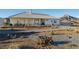 House exterior with covered patio and desert landscaping at 4351 W Bell Vista Ave, Pahrump, NV 89060