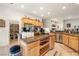 Large kitchen island with granite countertops and walk-in pantry at 4351 W Bell Vista Ave, Pahrump, NV 89060