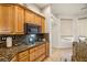 Kitchen features gas cooktop, microwave, and granite countertops at 4351 W Bell Vista Ave, Pahrump, NV 89060