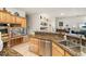 Kitchen with granite countertops, stainless steel dishwasher, and wood cabinets at 4351 W Bell Vista Ave, Pahrump, NV 89060