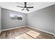 Bright bedroom with wood-look floors and ceiling fan at 4431 El Cebra Way, Las Vegas, NV 89121