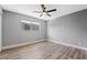 Bright bedroom with wood-look floors and ceiling fan at 4431 El Cebra Way, Las Vegas, NV 89121