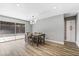 Bright dining room with hardwood floors and sliding glass doors at 4431 El Cebra Way, Las Vegas, NV 89121