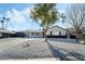 Modern house exterior with white and black accents and gravel landscaping at 4431 El Cebra Way, Las Vegas, NV 89121