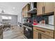 Modern kitchen with stainless steel appliances and a gas cooktop at 4431 El Cebra Way, Las Vegas, NV 89121