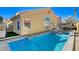 Exterior view of backyard with pool, spa, patio, and outdoor dining furniture set for relaxation and entertainment at 4532 Laguna Vista St, Las Vegas, NV 89147