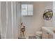 Cozy bathroom with a shower, toilet, and decorative plants for a spa-like feel at 4532 Laguna Vista St, Las Vegas, NV 89147