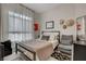 Stylish bedroom featuring a modern bed frame, soft bedding, and decorative wall art at 4532 Laguna Vista St, Las Vegas, NV 89147