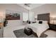 Relaxing main bedroom with tufted headboard and plenty of natural light at 4532 Laguna Vista St, Las Vegas, NV 89147