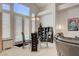 Bright dining area with glass table and chairs, adjacent to living room at 4532 Laguna Vista St, Las Vegas, NV 89147