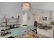 Elegant dining room featuring a glass table and stylish decor at 4532 Laguna Vista St, Las Vegas, NV 89147