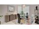 Modern dining room with glass table and chandelier at 4532 Laguna Vista St, Las Vegas, NV 89147