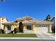 Beautiful single-story home with a two-car garage and well-manicured lawn at 4532 Laguna Vista St, Las Vegas, NV 89147