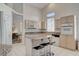 Well-equipped kitchen with granite island, light wood cabinets, and modern appliances at 4532 Laguna Vista St, Las Vegas, NV 89147