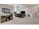 Living room with a sectional sofa and entertainment center at 4532 Laguna Vista St, Las Vegas, NV 89147