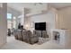 Living room with sectional sofa, fireplace, and high ceilings at 4532 Laguna Vista St, Las Vegas, NV 89147