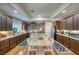 Large kitchen with granite countertops and dark wood cabinets at 5170 Agio Ave, Pahrump, NV 89061