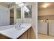 Bright bathroom vanity with modern fixtures and convenient in-unit laundry area at 5340 Silvermist Ct # 103, Las Vegas, NV 89122