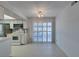 Bright dining area adjacent to the kitchen with tile flooring and sliding glass doors to the outdoor area at 5340 Silvermist Ct # 103, Las Vegas, NV 89122