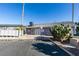 Exterior view of the community clubhouse with ample parking and desert landscaping at 5340 Silvermist Ct # 103, Las Vegas, NV 89122