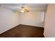 Bright bedroom with dark laminate wood flooring and ceiling fan at 5453 Requa Ave, Las Vegas, NV 89110