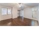 Spacious bedroom with dark wood laminate flooring and ceiling fan at 5453 Requa Ave, Las Vegas, NV 89110