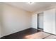 Simple bedroom with dark wood floors and closet at 5453 Requa Ave, Las Vegas, NV 89110