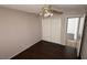 Bedroom with double door closet and dark laminate flooring at 5453 Requa Ave, Las Vegas, NV 89110