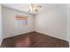 Bright bedroom with dark wood floors and ceiling fan at 5453 Requa Ave, Las Vegas, NV 89110