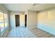 Bedroom with access to bathroom and tile flooring at 5453 Requa Ave, Las Vegas, NV 89110