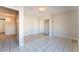 Simple bedroom with tile floors and mirrored closet at 5453 Requa Ave, Las Vegas, NV 89110